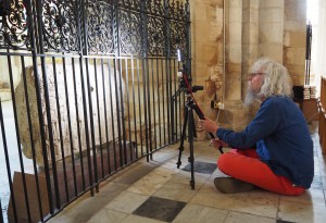 Positioning the camera to photograph the stone through the railings